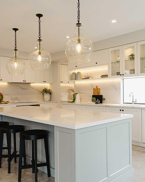 Modern kitchen with large island and bar area.