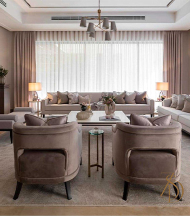 Living room with beige furniture and chandelier centerpiece.