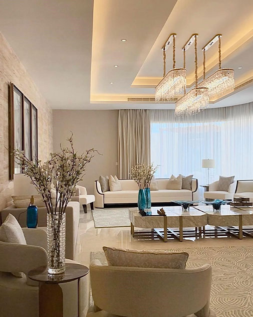 Modern living room with white furniture and chandelier